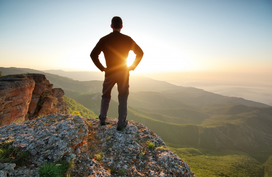Man on top of mountain. Conceptual scene.
